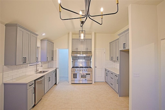 kitchen featuring a sink, stainless steel appliances, and gray cabinetry
