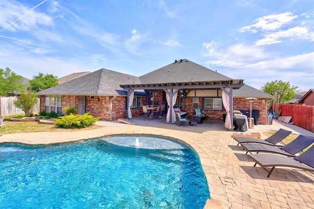 view of swimming pool with fence, a pergola, a fenced in pool, and a patio area