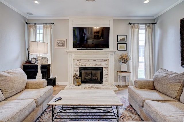 living room featuring recessed lighting, a wealth of natural light, and wood finished floors