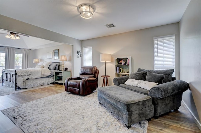 bedroom with visible vents and wood finished floors