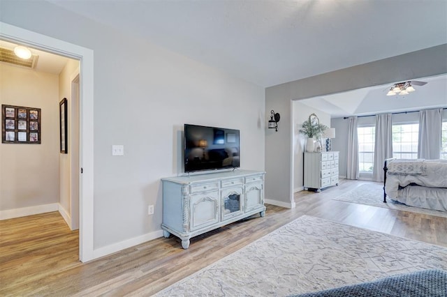 bedroom featuring baseboards, visible vents, and light wood-style flooring