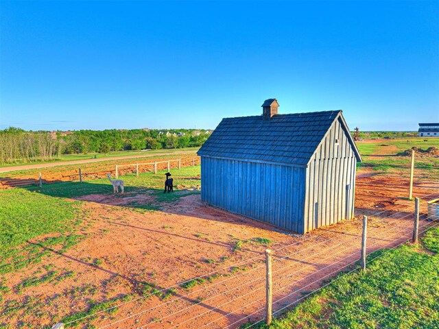 18443 Boardwalk Xing, Norman, OK 73072 - view of shed featuring a rural view and fence