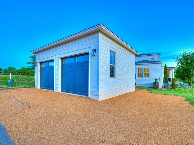 18443 Boardwalk Xing, Norman, OK 73072 - detached garage featuring central AC unit