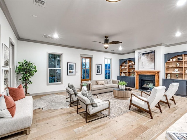 18443 Boardwalk Xing, Norman, OK 73072 - living area with light wood-style floors, visible vents, ornamental molding, and recessed lighting