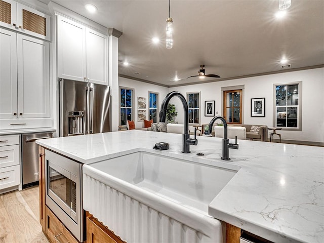 18443 Boardwalk Xing, Norman, OK 73072 - kitchen featuring hanging light fixtures, a sink, stainless steel appliances, open floor plan, and recessed lighting