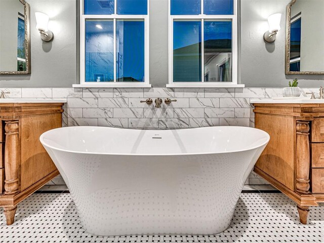 18443 Boardwalk Xing, Norman, OK 73072 - full bathroom featuring wainscoting, tile walls, and a freestanding tub