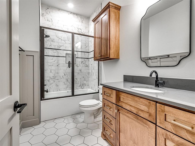 18443 Boardwalk Xing, Norman, OK 73072 - bathroom featuring toilet, vanity, and shower / bath combination with glass door