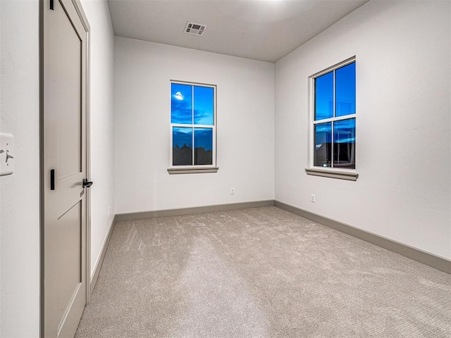18443 Boardwalk Xing, Norman, OK 73072 - unfurnished bedroom featuring baseboards, carpet flooring, and visible vents