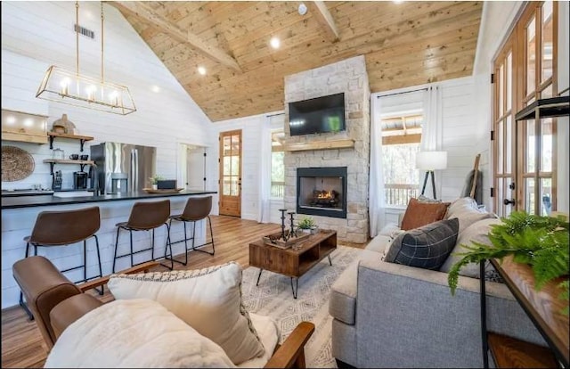 119 Leadwood Trl, Broken Bow, OK 74728 - living room featuring wood finished floors, a healthy amount of sunlight, high vaulted ceiling, and wooden ceiling