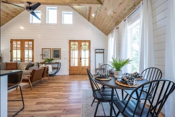 119 Leadwood Trl, Broken Bow, OK 74728 - dining room featuring wood finished floors, wood ceiling, high vaulted ceiling, and french doors