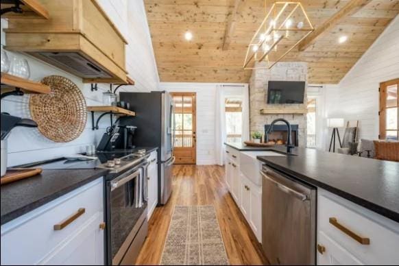 119 Leadwood Trl, Broken Bow, OK 74728 - kitchen with dark countertops, appliances with stainless steel finishes, and wood ceiling