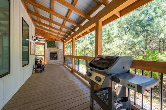 119 Leadwood Trl, Broken Bow, OK 74728 - wooden deck featuring grilling area and an outdoor stone fireplace