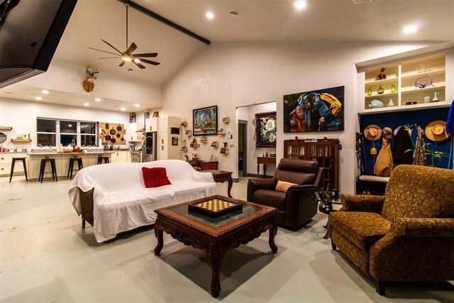 living room featuring recessed lighting, high vaulted ceiling, a ceiling fan, and concrete flooring