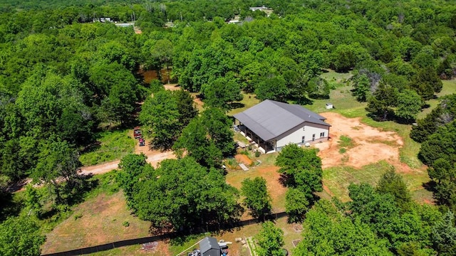 birds eye view of property with a wooded view