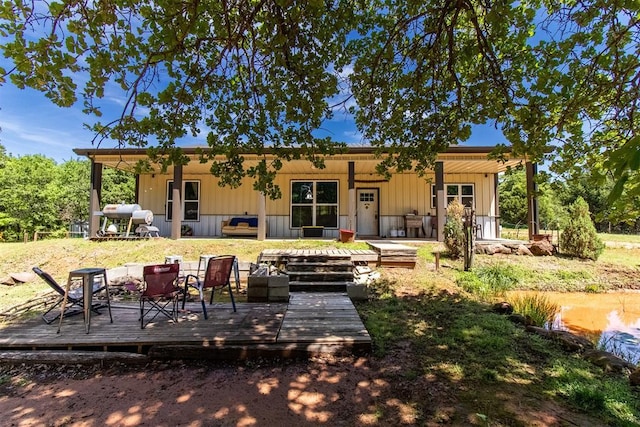 back of property with a deck
