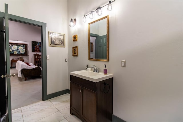 bathroom with vanity and baseboards