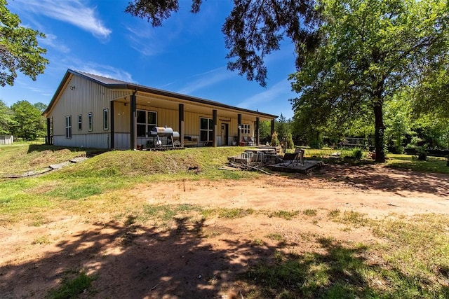back of house with a patio