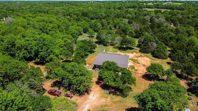 birds eye view of property with a forest view