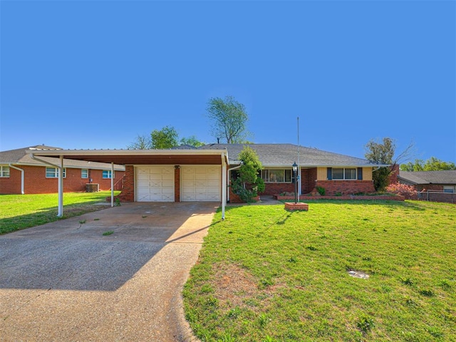 3402 Oakhurst Dr, Oklahoma City, OK 73110 - ranch-style home with a garage, brick siding, a front lawn, and concrete driveway