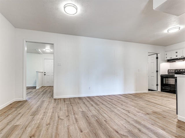 3402 Oakhurst Dr, Oklahoma City, OK 73110 - unfurnished living room with baseboards and light wood-style floors