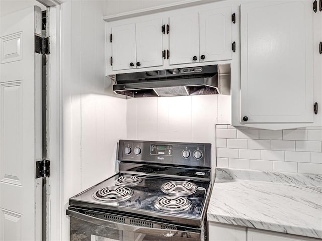 3402 Oakhurst Dr, Oklahoma City, OK 73110 - kitchen featuring decorative backsplash, white cabinetry, black range with electric stovetop, and under cabinet range hood