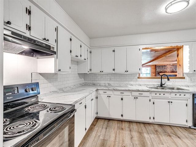 3402 Oakhurst Dr, Oklahoma City, OK 73110 - kitchen featuring white cabinets, under cabinet range hood, black / electric stove, and a sink