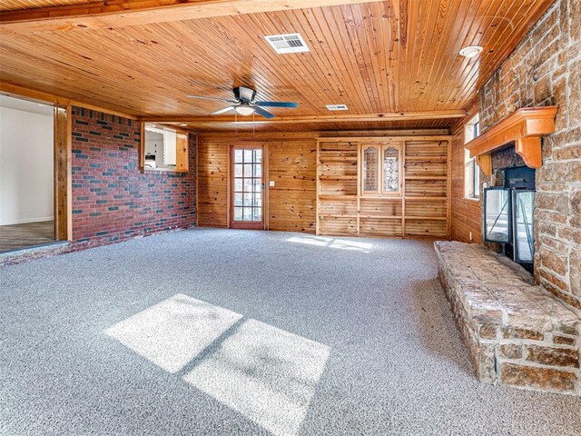 3402 Oakhurst Dr, Oklahoma City, OK 73110 - unfurnished living room with visible vents, ceiling fan, a fireplace, wooden ceiling, and carpet floors