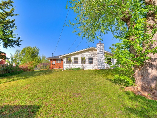 3402 Oakhurst Dr, Oklahoma City, OK 73110 - exterior space with fence, a lawn, and a chimney