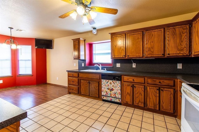 kitchen with brown cabinets, electric stove, dishwashing machine, and a sink
