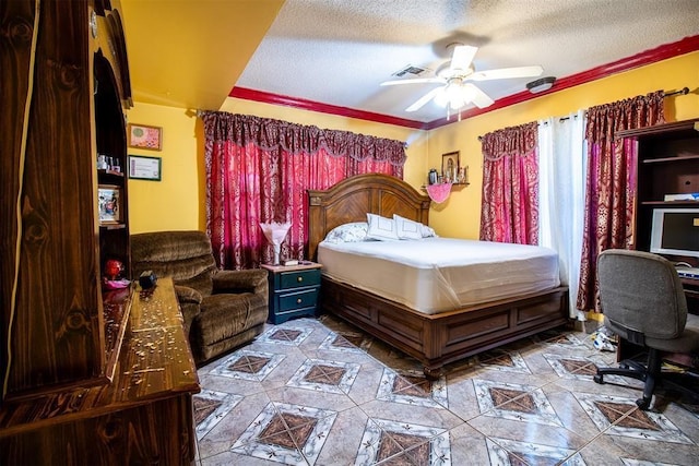 bedroom featuring a ceiling fan, a textured ceiling, and visible vents