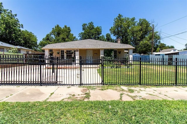 view of front of house with a chimney, fence private yard, and a front yard