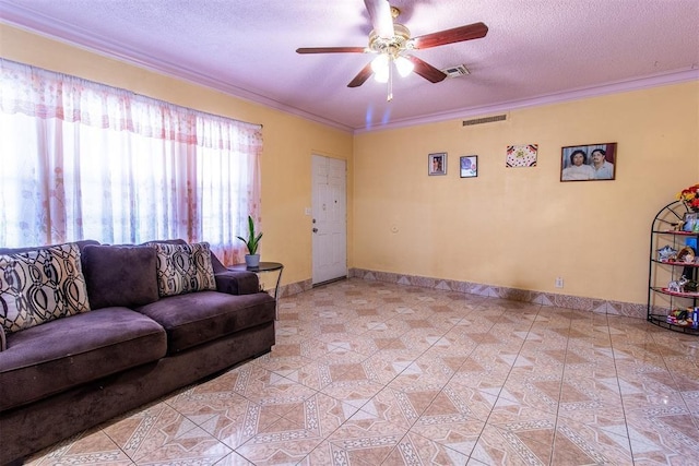living area featuring a textured ceiling, visible vents, a ceiling fan, and ornamental molding