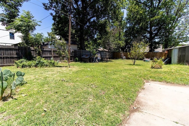 view of yard with a fenced backyard