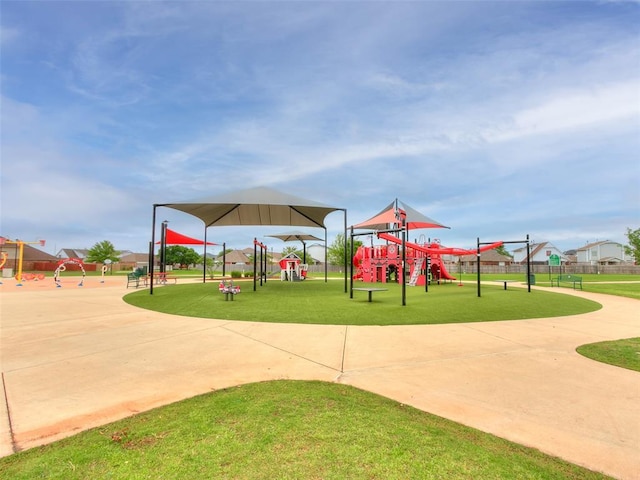 communal playground featuring a lawn