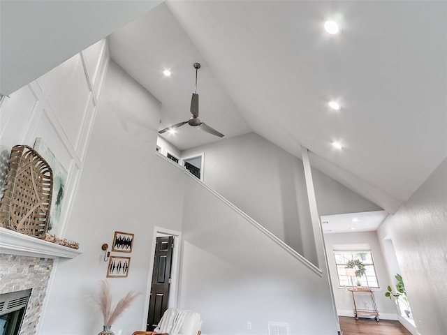interior space featuring recessed lighting, a ceiling fan, and a fireplace
