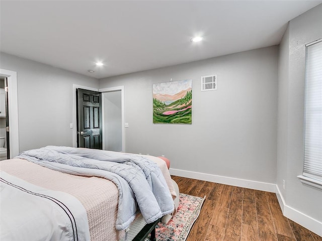 bedroom with visible vents, recessed lighting, dark wood finished floors, and baseboards