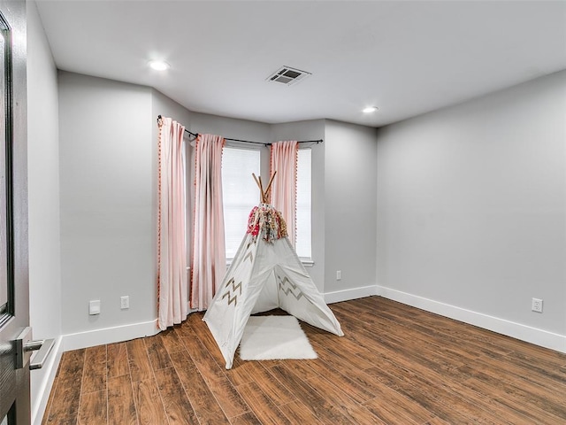 game room featuring wood finished floors, visible vents, recessed lighting, and baseboards