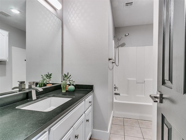 full bath featuring bathtub / shower combination, visible vents, vanity, and tile patterned flooring