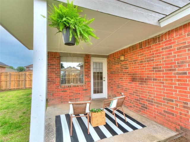view of patio featuring fence