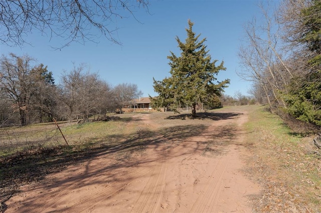 view of street featuring dirt driveway