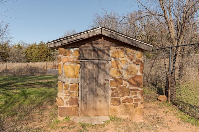 view of shed with fence