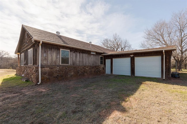 exterior space with driveway and a front yard