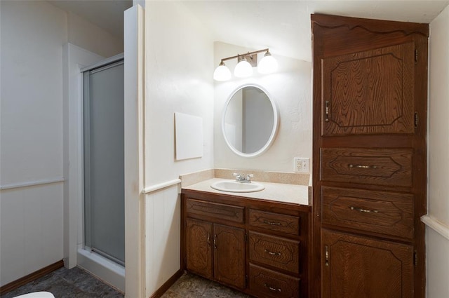 bathroom featuring vanity and a shower stall