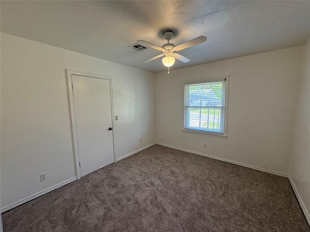 608 Roosevelt St, Seminole, OK 74868 - unfurnished room featuring baseboards, a ceiling fan, visible vents, and carpet