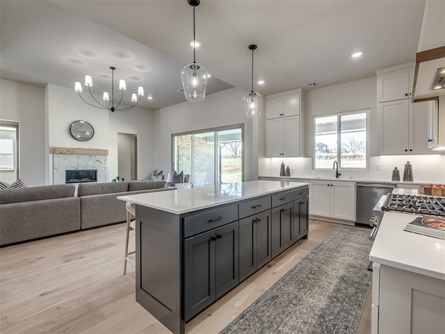 1529 Pedras Pl, Newcastle, OK 73065 - kitchen featuring a sink, plenty of natural light, dishwasher, white cabinets, and recessed lighting