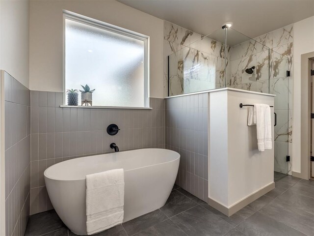1529 Pedras Pl, Newcastle, OK 73065 - full bath featuring tile walls, a tile shower, a soaking tub, and tile patterned flooring