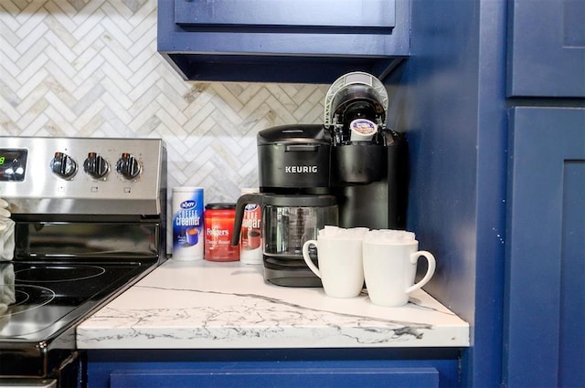 66 Morning Pines Trl, Broken Bow, OK 74728 - room details with stainless steel electric range oven, light countertops, blue cabinetry, and tasteful backsplash