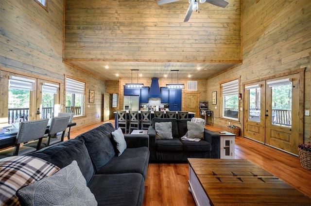66 Morning Pines Trl, Broken Bow, OK 74728 - living room featuring ceiling fan, a high ceiling, light wood-style flooring, and visible vents