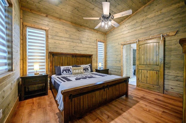 66 Morning Pines Trl, Broken Bow, OK 74728 - bedroom with wood ceiling, a ceiling fan, vaulted ceiling, wood walls, and wood finished floors