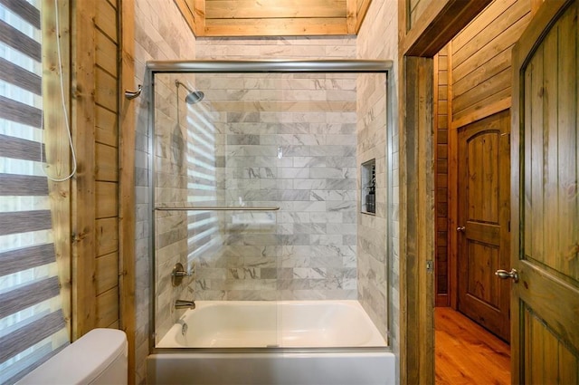 66 Morning Pines Trl, Broken Bow, OK 74728 - full bath with enclosed tub / shower combo, toilet, and wood finished floors
